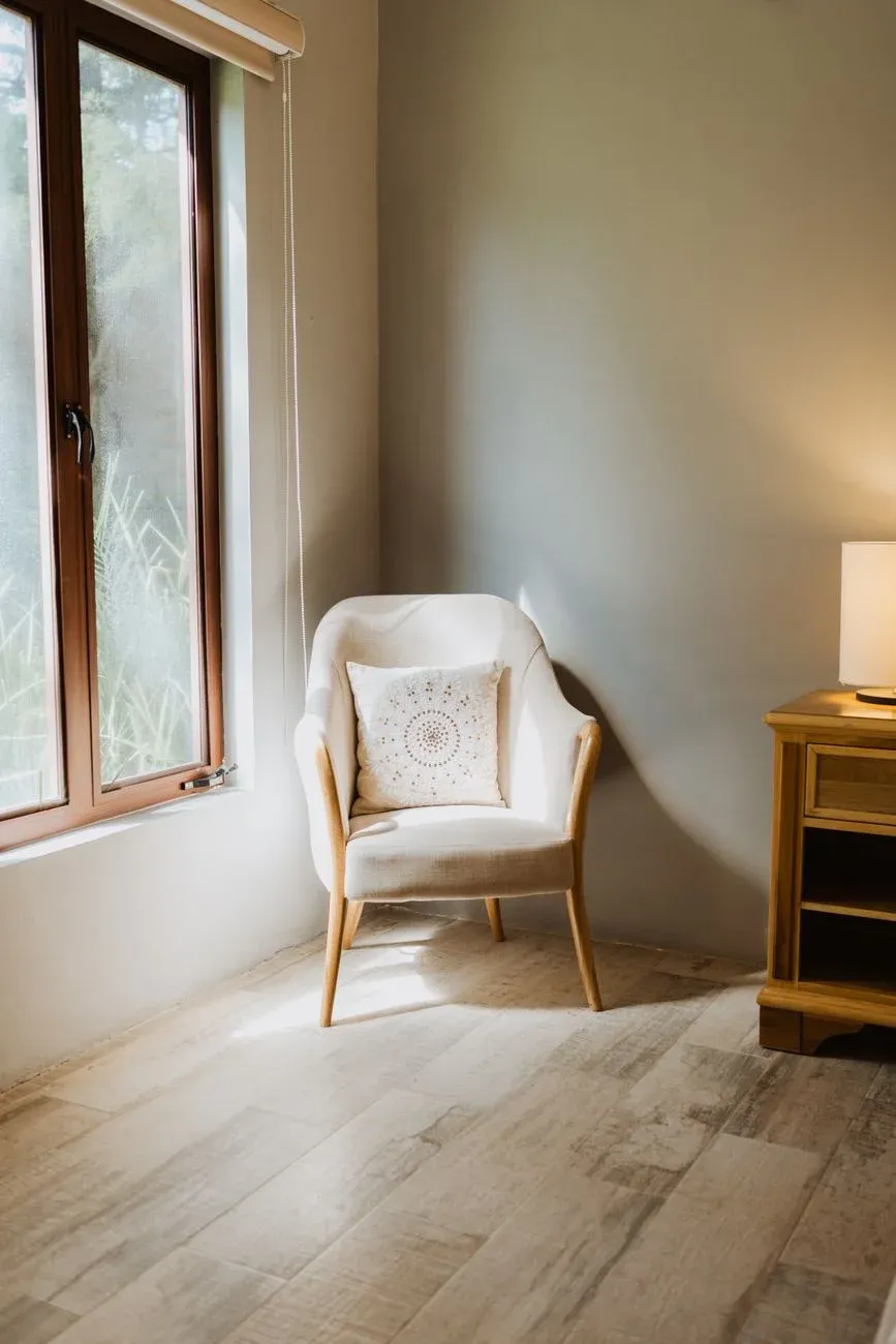 A soft armchair in a calm, naturally lit room