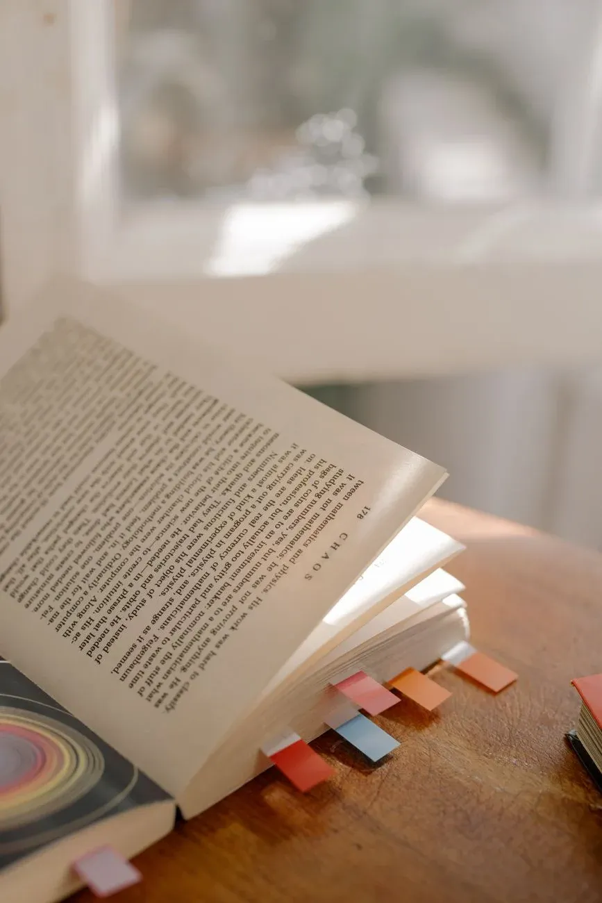 A close-up of open book pages in soft natural light